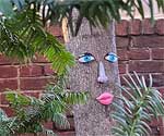 Female Tree Face with Red Lips and Eyelashes